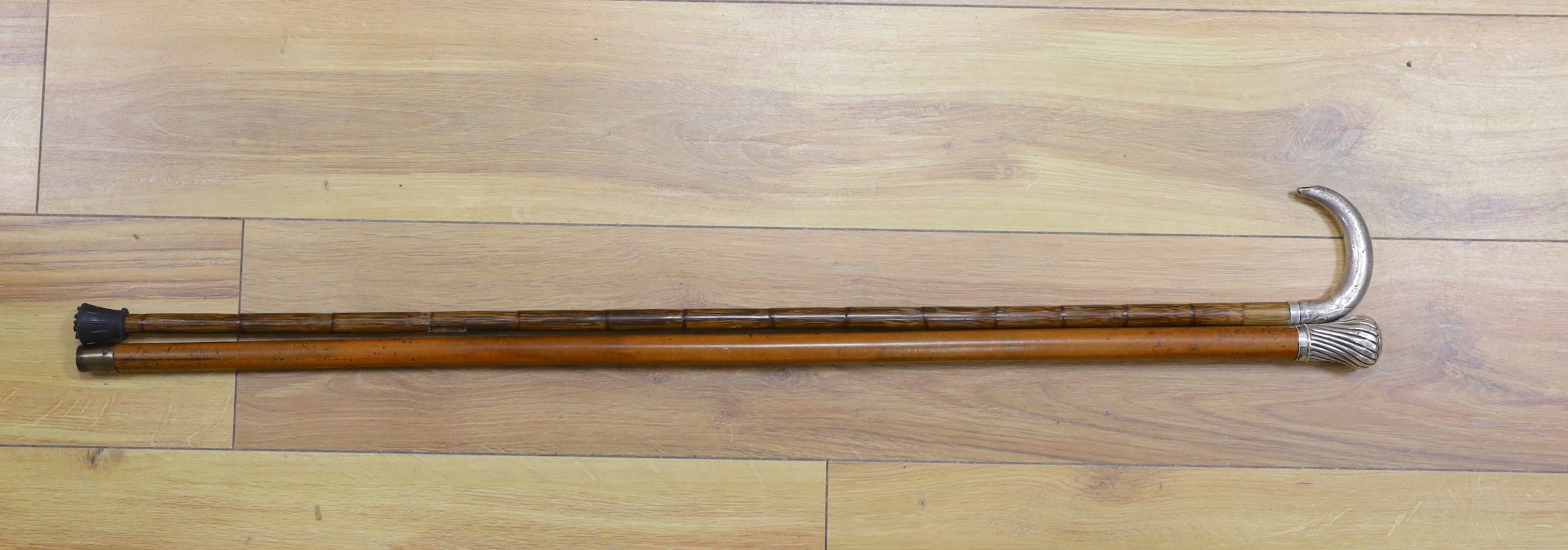 A silver-mounted malacca walking cane and a silver-mounted walking stick, 88cm